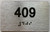 HOTEL DIRECTIONAL SIGN APARTMENT NUMBER 409