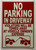 No parking in driveway with image HPD SIGN