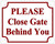 PLEASE CLOSE GATE BEHIND YOU BUILDING SIGN