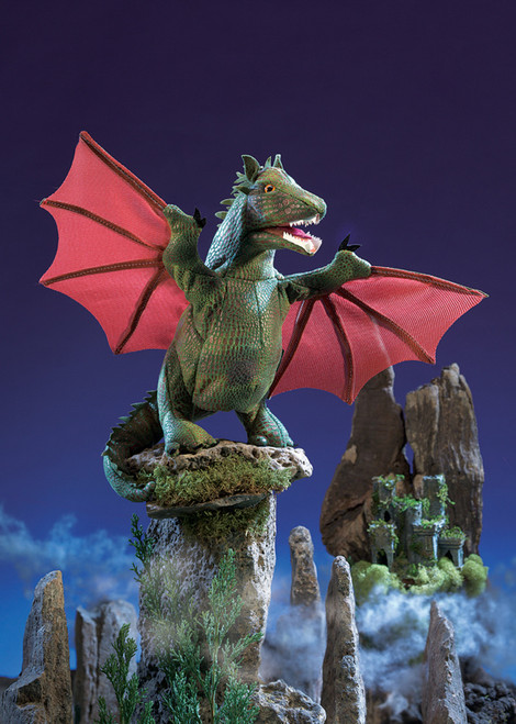 The Folkmanis Winged Dragon Puppet is a bold and fierce fantasy creature designed for imaginative play.

This green flying reptile features a movable mouth and wings, allowing for interactive storytelling and adventure.

Features:
Realistic design with detailed scales, expressive eyes, and large wings.
Movable mouth and wings for engaging puppet play.
Award-winning toy, recognized by ASTRA, Creative Child Awards, NAPPA, and PAL Awards.
Durable and soft materials, making it comfortable to handle.

Suitable for ages 3+.

Dimensions: 38 cm long, 23 cm high, with a 30 cm wingspan.

This puppet is perfect for fantasy lover