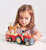 This cheery wooden tractor, painted in bright red, is perfect for little hands.

It comes with a removable trailer, a friendly driver, two hay bales, a horse, and a goose.

Whether they’re playing on the farm or embarking on imaginative adventures, kids aged 18 months and up will love this durable and beautifully illustrated toy.


Ages 18months+
