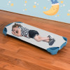 Preschool cot sheets in white poly-cotton, each with four elastic corners, shown folded and in use on a children's nap cot.