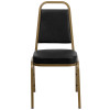 TYCOON Series Trapezoidal Back Stacking Banquet Chair in Black Vinyl - Gold Frame