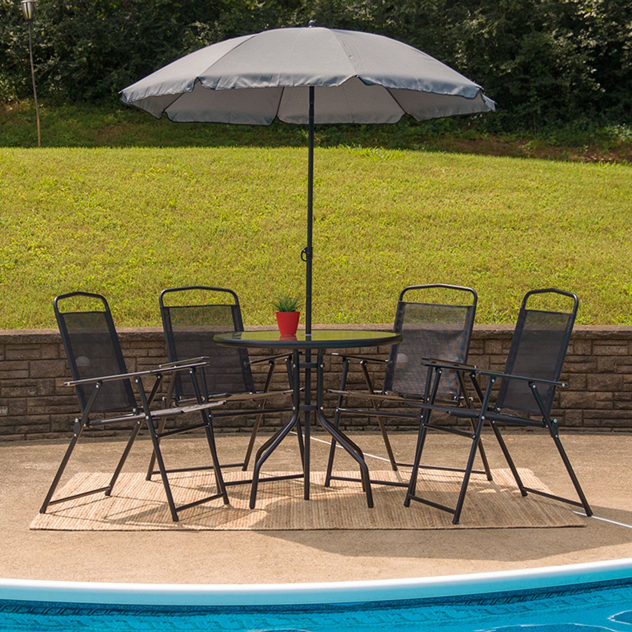 glass patio table and chairs with umbrella