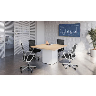 Modern square conference table with cube base in walnut finish inside a contemporary office meeting room