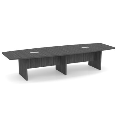 Premium boat-shaped conference table in modern walnut finish positioned in a professional executive conference room