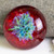 Vivid Red and Spring A Bouquet adorn this 25mm boro lampwork glass implosion cabochon