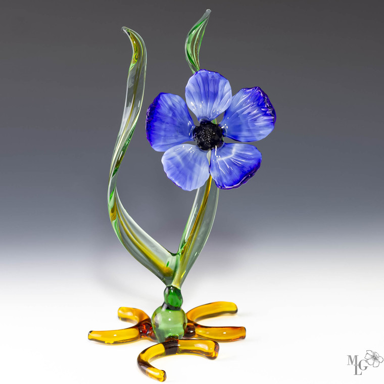 The mystery of the spring bloom in it's elegant ruffled blue petals. The glass is sparkling and the leaves are transparent giving the sculpture sense of light and movement