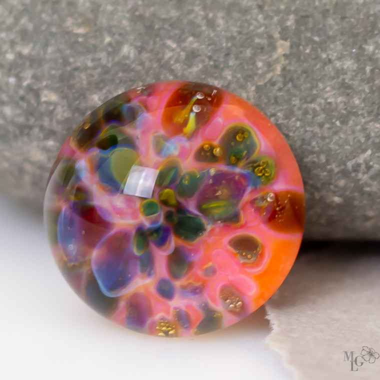 A bold dash of fun iridescent colors dance thru this little 17mm lampwork glass cabochon