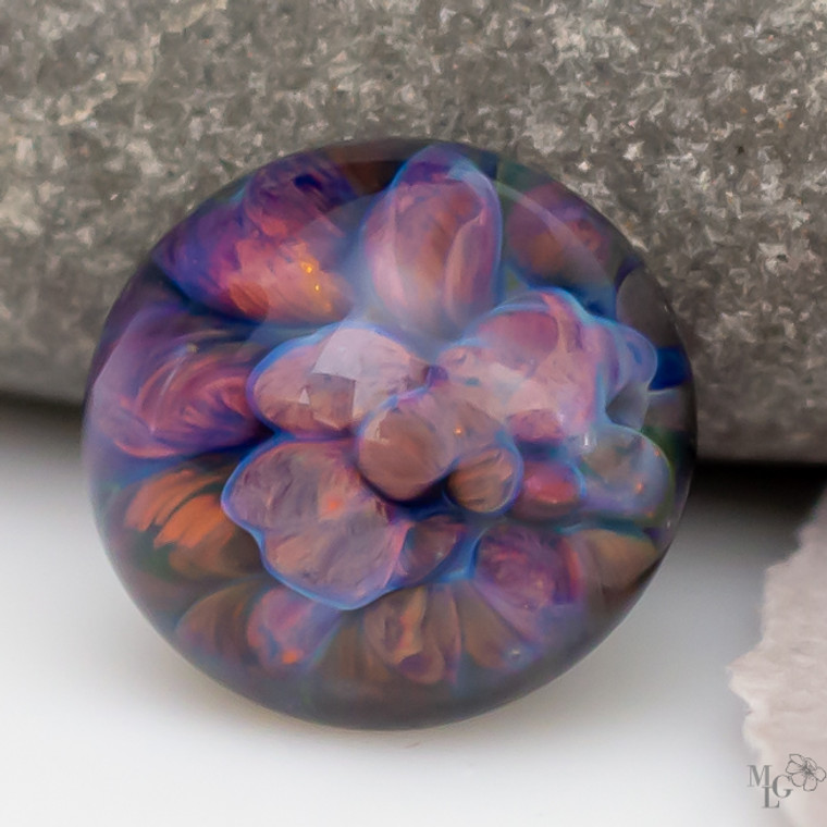 Rich deep colors bubbling up in large textures under their clear glass dome. This little 15mm glass cabochon packs a punch for its small size