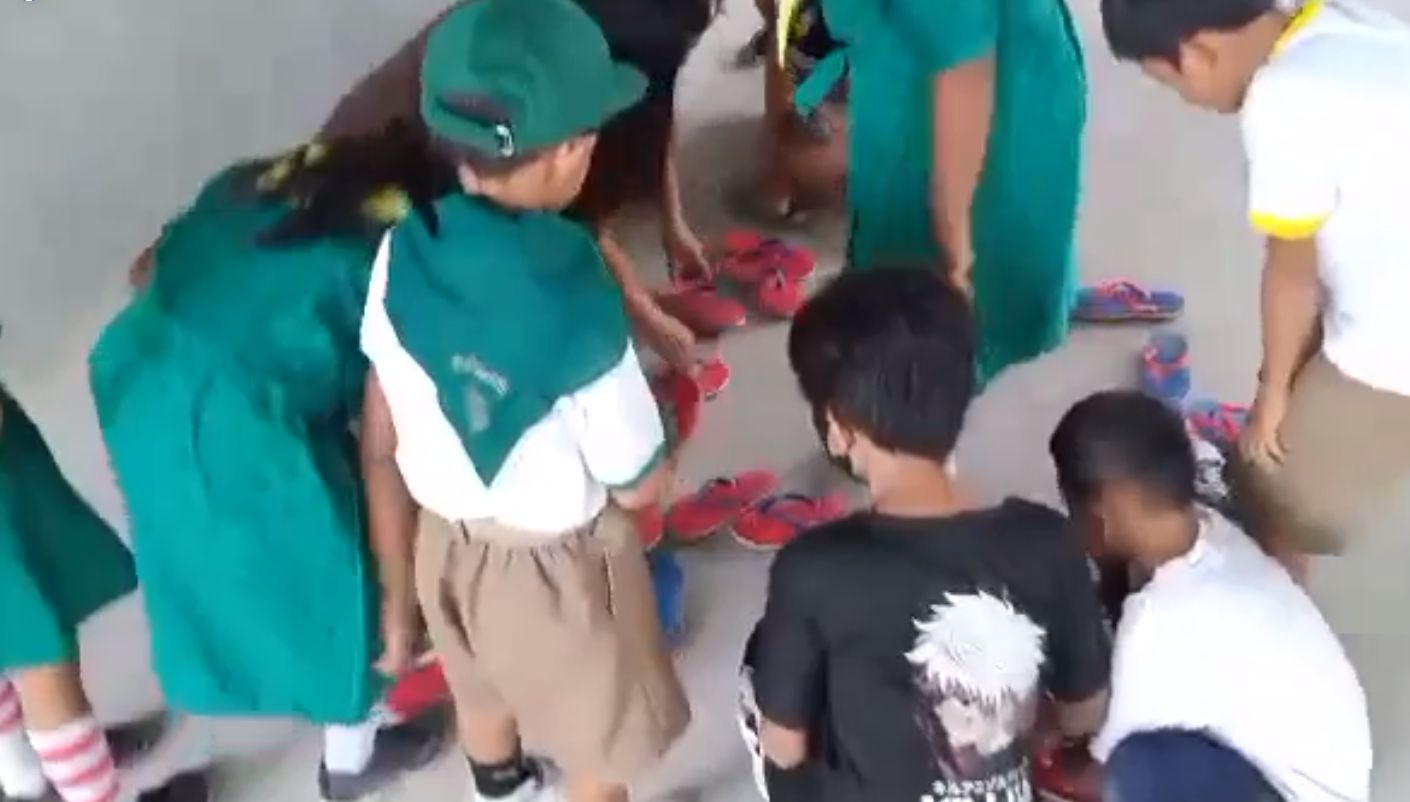 children receiving slippers