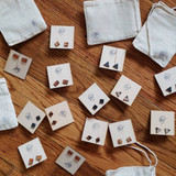 Leather stud on wooden earring card with muslin bags