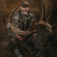 Close-up of a whitetail buck harvested in a lush TRIFECTA food plot, highlighting the nutritional benefits of the Magnet Outdoors mix that supports healthy deer growth throughout the hunting season.