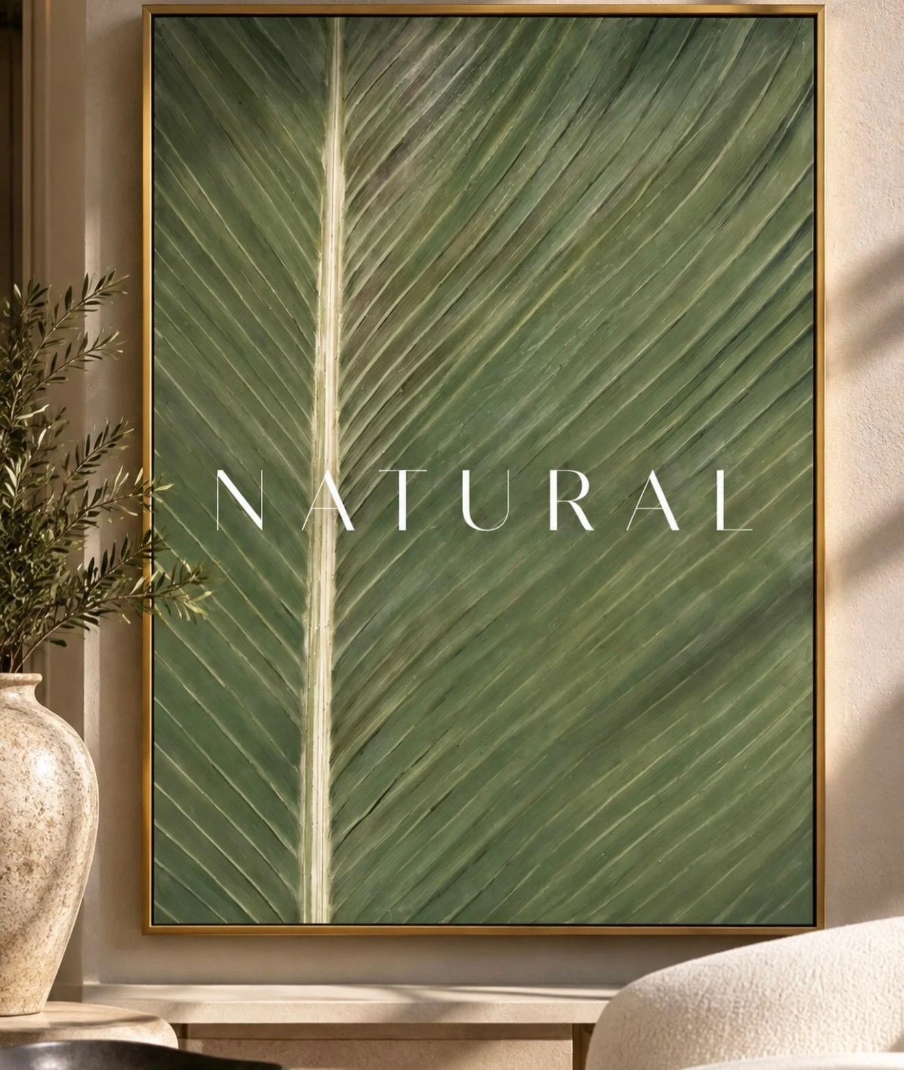 Large green botanical leaf artwork in a gold frame