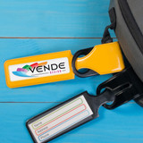 A yellow and black luggage tag with a logo and space for details like name, address, and phone number on a blue background.