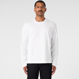 A long-sleeve white t-shirt worn by a model against a plain background. The shirt features a logo.
