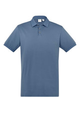 A short sleeve polo shirt in a soft blue colour, featuring a collar and three buttons, with a brand logo present.