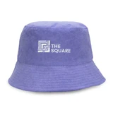 A purple reversible twill/terry bucket hat featuring a logo on the front.