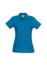 A blue ladies polo shirt featuring a collar and button placket, with a logo on the fabric.