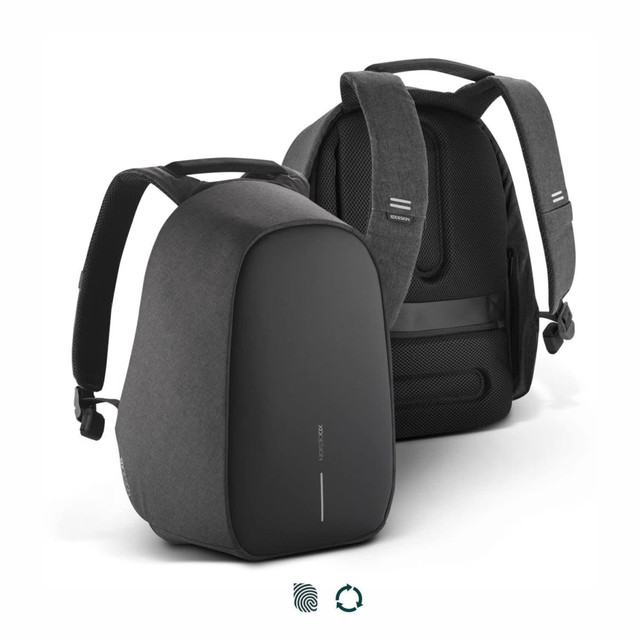 A grey and black backpack with adjustable straps and a sleek design, featuring a branding logo.