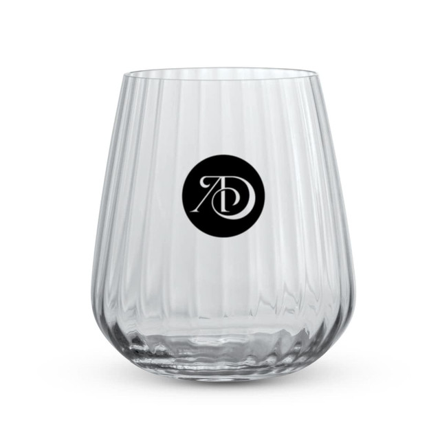 A clear, ribbed glass tumbler with a circular logo. Ideal for serving beverages.