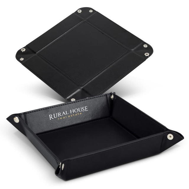 A black leather valet tray with silver snap fasteners and a branded interior.