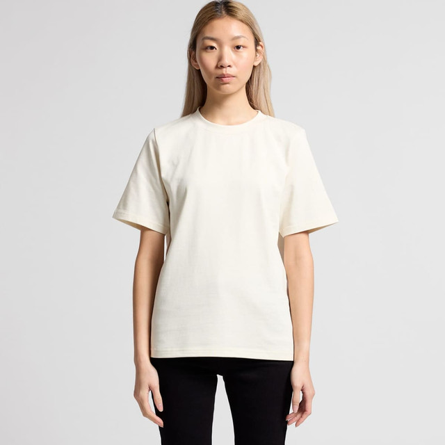 A plain cream T-shirt with short sleeves, featuring a simple design and a logo on the side.