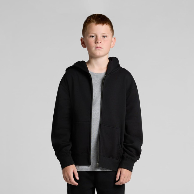 A youth zip hoodie in black, featuring a front zip, hood, and side pockets, styled with a grey t-shirt underneath.