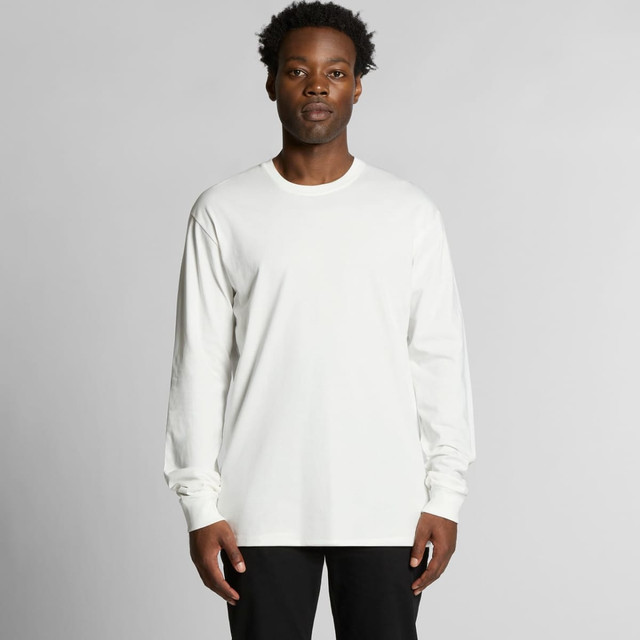 A long-sleeve, organic t-shirt in white, featuring a logo, modelled by a person against a plain background.