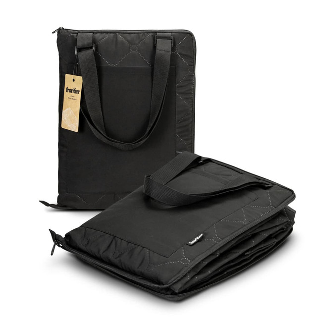 A black picnic blanket with a quilted design, featuring carrying handles and a logo. It is folded for easy transport.