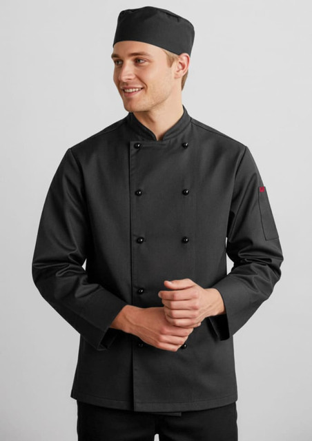 A black long sleeve chef jacket with a buttoned front and a matching chef hat. The model is smiling.