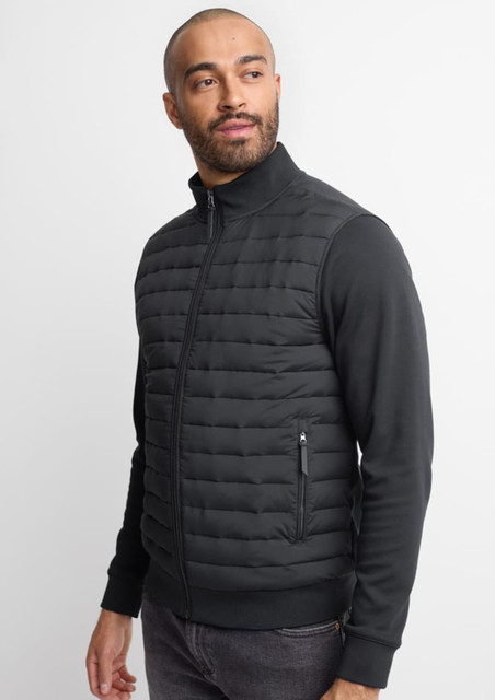 A men's tailored jacket in black, featuring quilted detailing and a zippered pocket on the side.