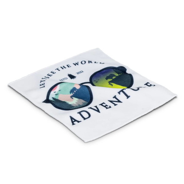 A square cloth featuring colourful sunglasses illustrations and text, primarily white with green, blue, and pink accents.
