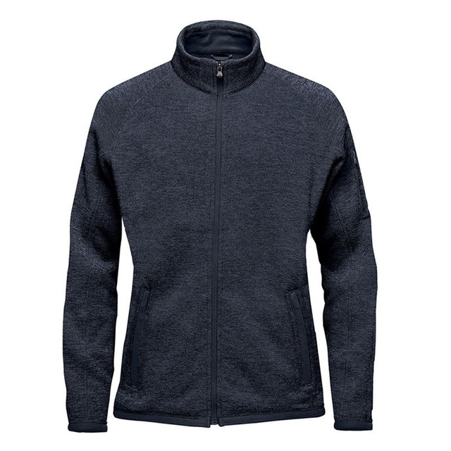 A women's full zip fleece jacket in dark grey with a logo on the sleeve and zippered pockets.