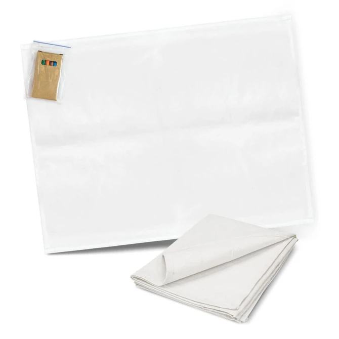 A white cotton tea towel with a folded corner, accompanied by a set of colouring pens.