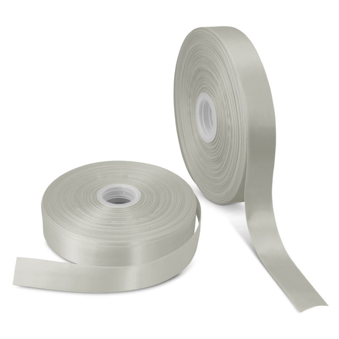 A roll of personalised ribbon in a soft, pale green colour alongside another roll, both on spools.