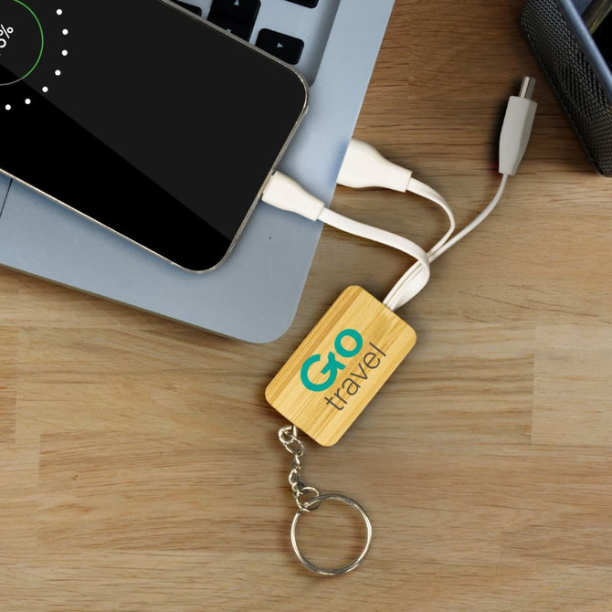 A bamboo charging cable key ring in a rectangle shape, featuring a keyring attachment and white charging cables.
