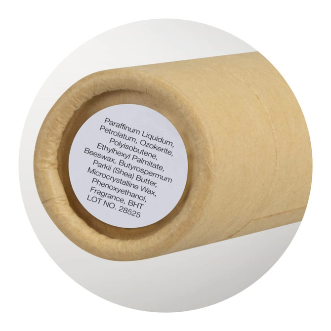 A Kraft Lip Balm tube in a natural brown paper packaging, featuring a circular label with ingredients.