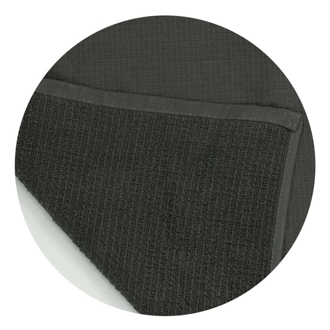 A dark green waffle towel with a textured surface and a smooth border, featuring a branding logo.