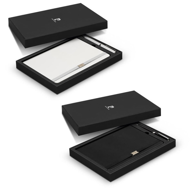 A black gift box containing a white notebook and a pen, both featuring a logo, presented elegantly.