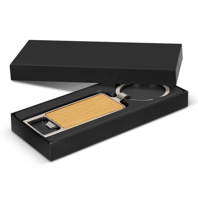 A drink bottle opener key ring with a wooden handle and silver metal features, presented in a black gift box.