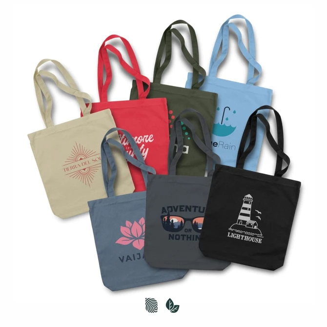 A collection of canvas tote bags in various colours including beige, blue, green, and black, featuring different designs and a logo.