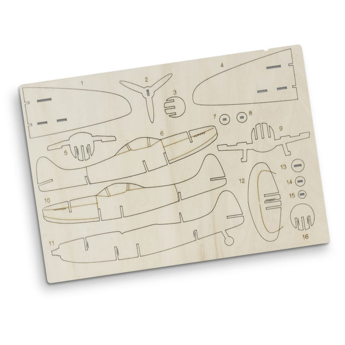 A wooden model kit of the Spitfire aircraft featuring various pre-cut parts in light beige. Includes a logo.