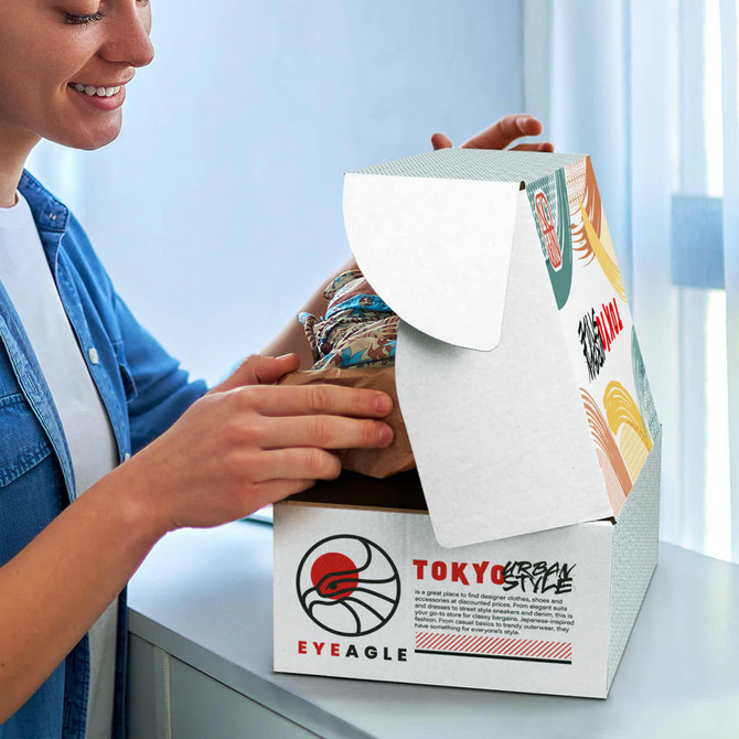 A white die cut box with a locking lid, opened to reveal contents inside. The box features a logo and colourful design elements.