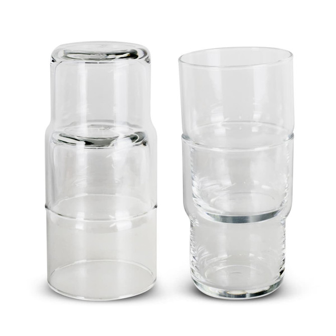A set of clear glass tumblers stacked together, featuring a sleek and modern design. Each tumbler has a smooth finish.