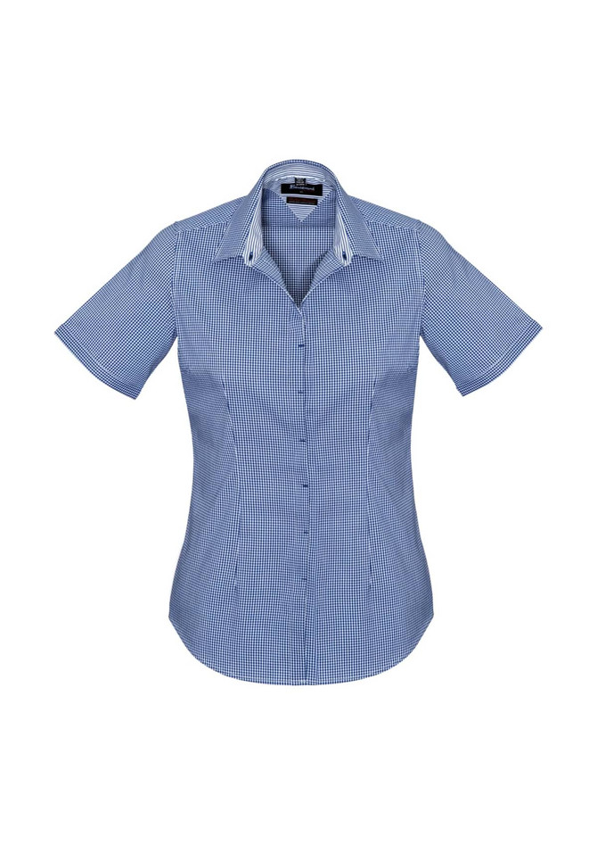 A short sleeve, button-up women's shirt featuring a blue and white checkered pattern and a logo.