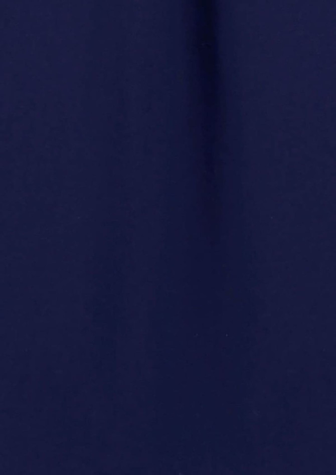 A long sleeve blouse in navy blue fabric with a smooth texture. The garment has a button-up design and a branding logo.