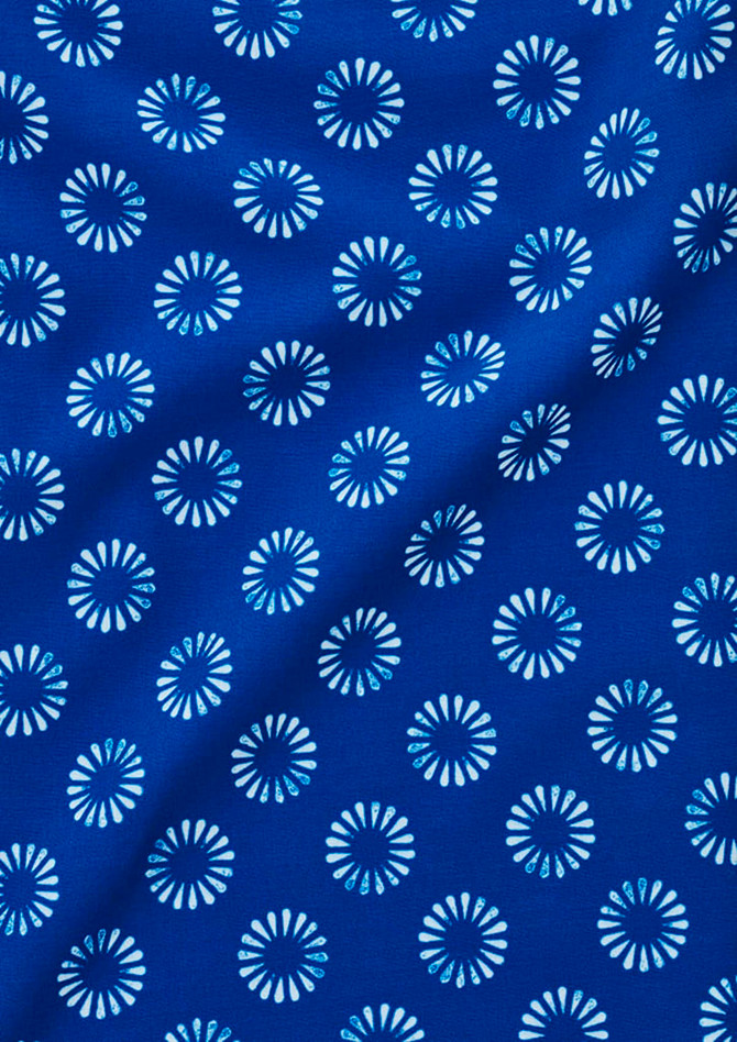 A blue fabric featuring a floral daisy print in white, suitable for a short sleeve shirt.
