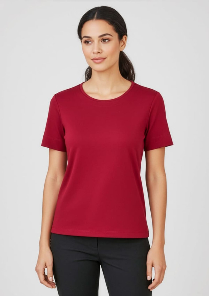 A maroon women's short sleeve jersey top with a round neckline and a fitted design, featuring a logo.