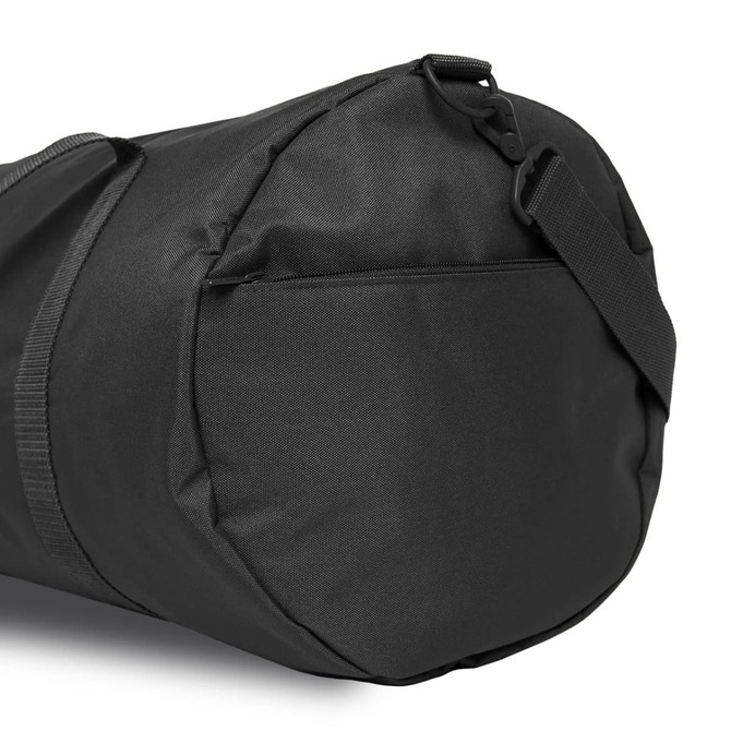 A black duffel bag featuring a zippered pocket and an adjustable strap. It has a simple design and is made of durable material.